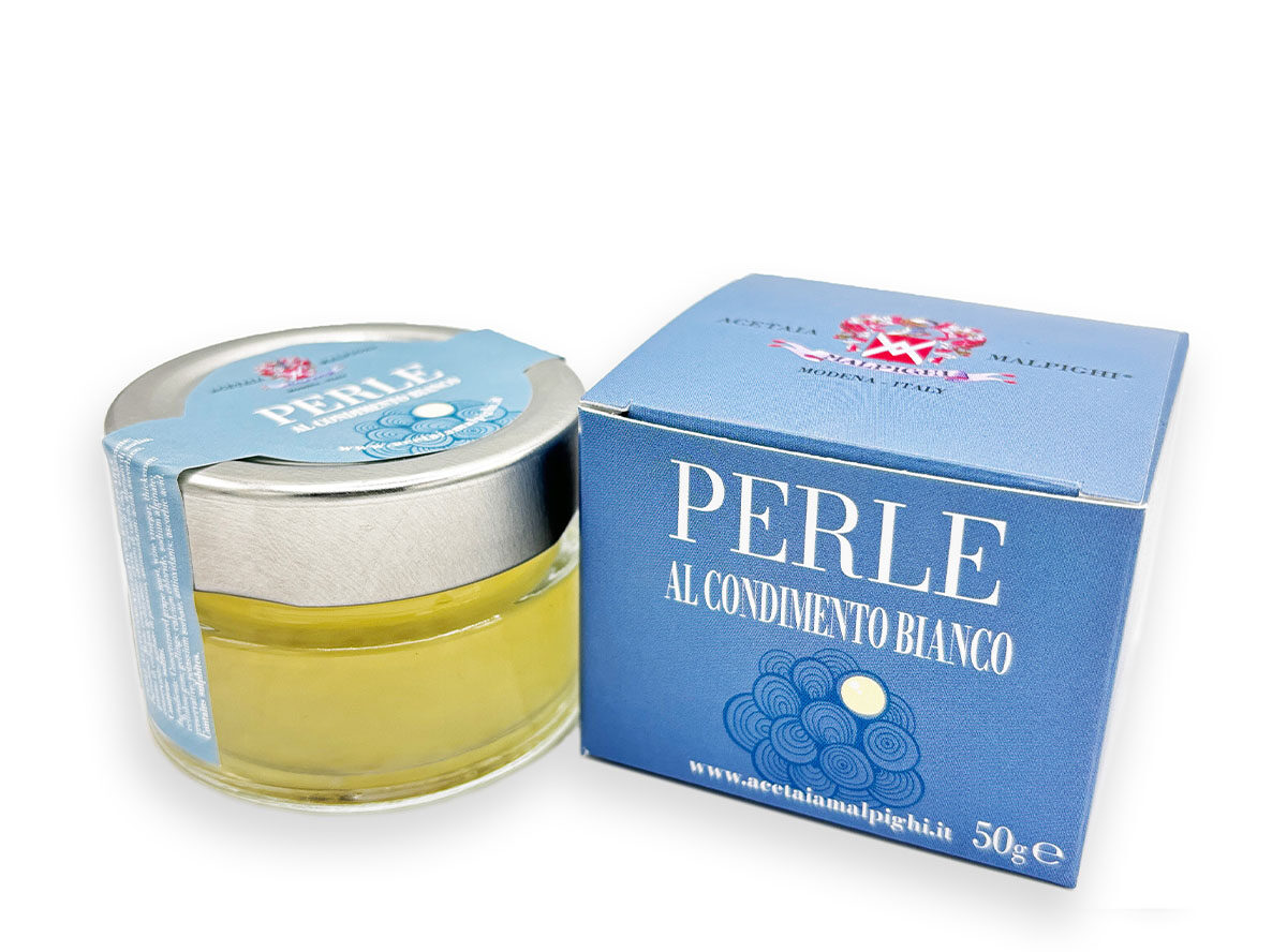 Perlas de Condimento Balsámico Blanco Acetaia Malpighi 50g Perlas de condimento balsámico blanco Acetaia Malpighi 50g en tarro, esferas gourmet de sabor suave y fresco para cocina creativa.