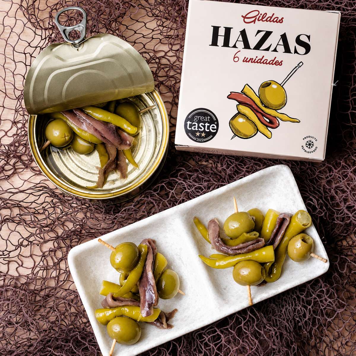 Gildas con Anchoa Hazas 6 Unidades Servidas Gildas con anchoa Hazas 6 unidades servidas junto a lata abierta y estuche original