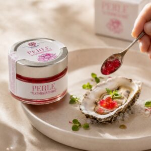 Perlas balsámicas Rosé Acetaia Malpighi con ostra y cuchara de servicio