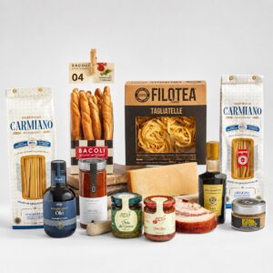 Cesta gourmet de pasta italiana con salsas, aceite de oliva, balsámico y queso parmesano