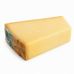 Queso Comté 24 meses AOC en bloque rectangular sobre fondo blanco