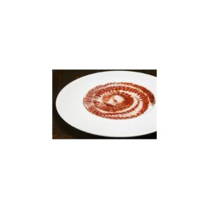 Jamón de bellota 100% ibérico cortado a cuchillo y presentado en plato