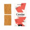 Crostine Mediterráneas Malafronte con aceite de oliva y tomate seco, crackers italianos crujientes en estuche con dos piezas visibles.